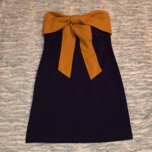 Purple dress with yellow bow